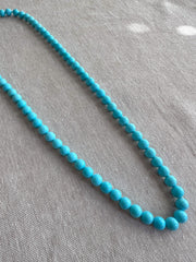 16-inch strand of AAA+ Sleeping Beauty Turquoise smooth round gemstone beads for fine jewelry making.
