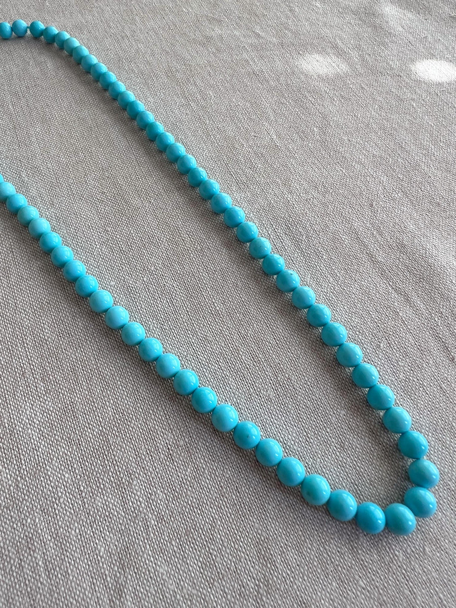 16-inch strand of AAA+ Sleeping Beauty Turquoise smooth round gemstone beads for fine jewelry making.