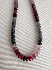 Strand of natural multi-color Spinel carved rondelle beads in graduated 5mm–6mm sizes for handmade jewelry. indoor lighting