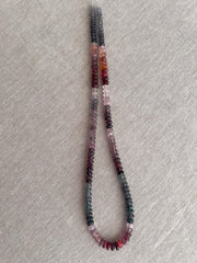 Strand of natural multi-color Spinel carved rondelle beads in graduated 5mm–6mm sizes for handmade jewelry.