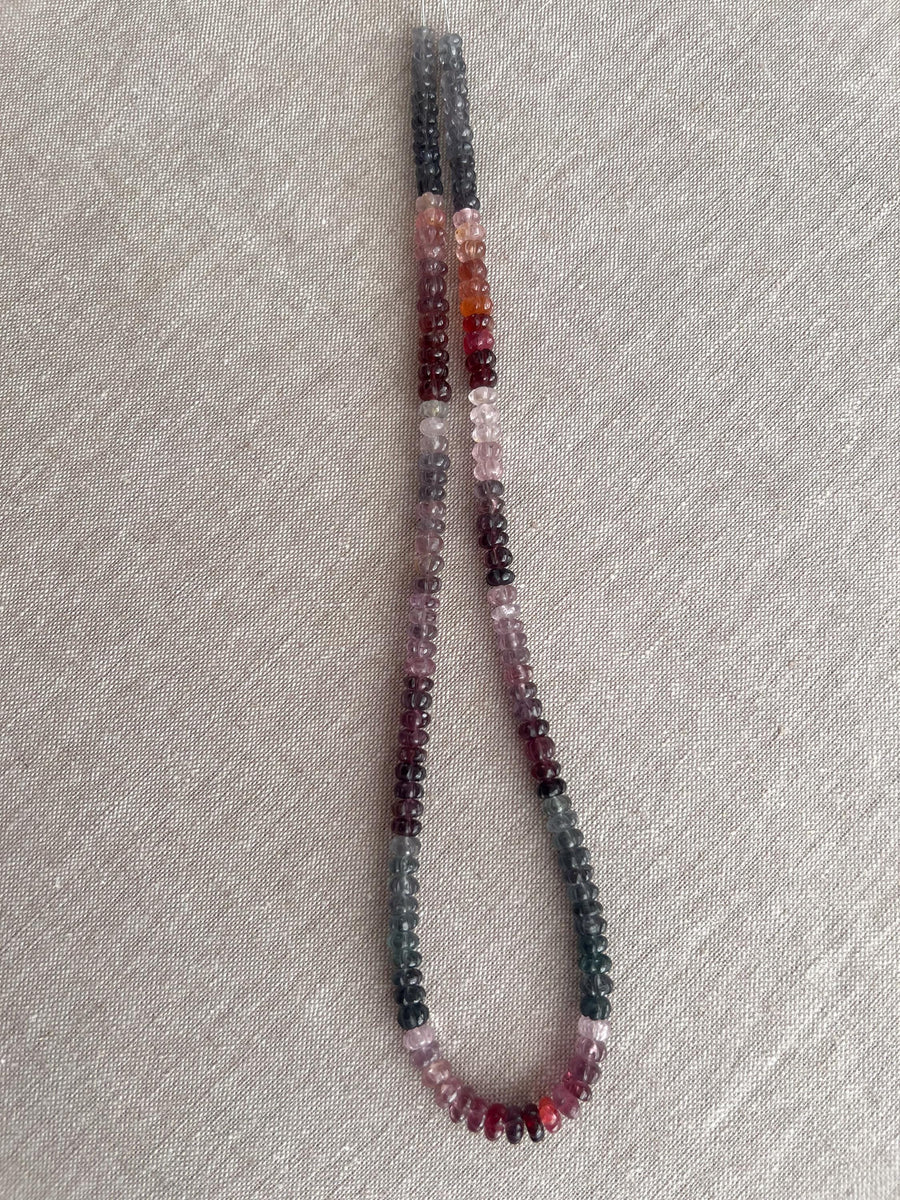 Strand of natural multi-color Spinel carved rondelle beads in graduated 5mm–6mm sizes for handmade jewelry.