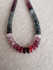 AAA natural Spinel gemstone beads with carved rondelle shapes in mixed pink, red, and gray tones.