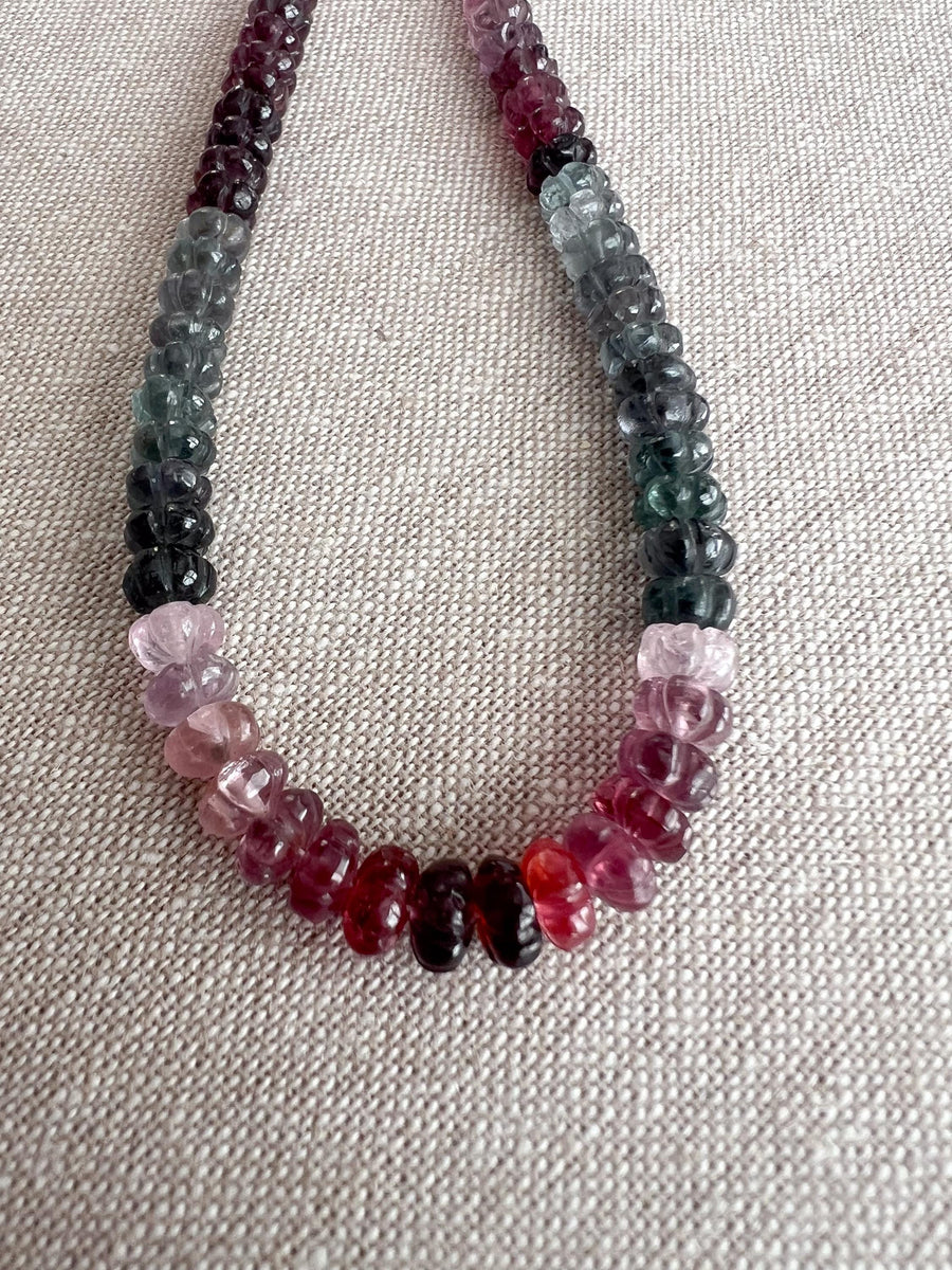 AAA natural Spinel gemstone beads with carved rondelle shapes in mixed pink, red, and gray tones.