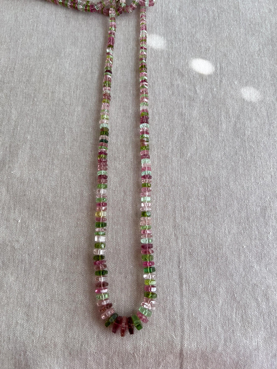 Strand of natural untreated Tourmaline faceted bolt beads in graduated sizes, ideal for fine jewelry making.