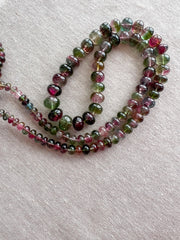 AAA-grade natural bi-color tourmaline smooth rondelle gemstone beads, graduated from 5.5mm to 11mm, featuring beautiful natural color variations for jewelry making.