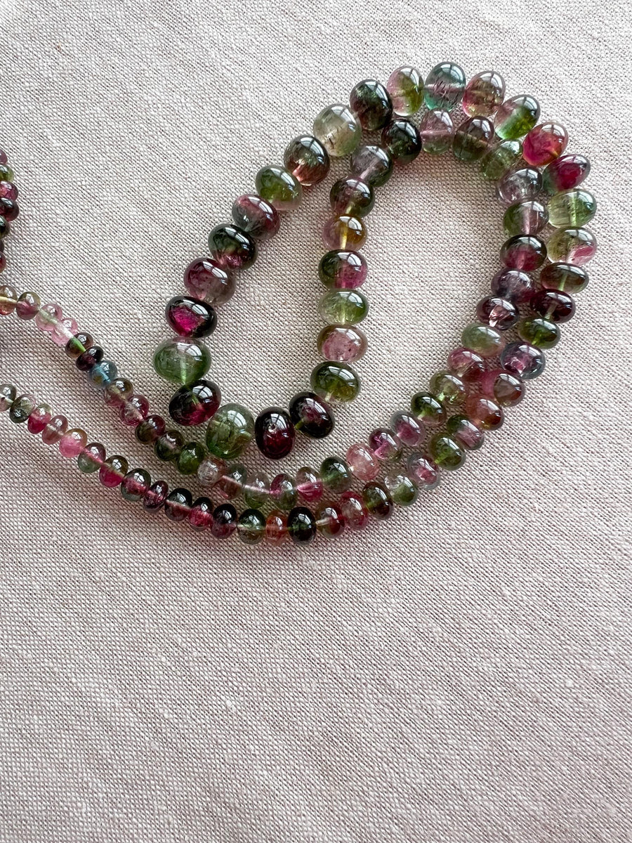 AAA-grade natural bi-color tourmaline smooth rondelle gemstone beads, graduated from 5.5mm to 11mm, featuring beautiful natural color variations for jewelry making.
