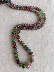 AAA-grade natural bi-color tourmaline smooth rondelle gemstone beads, graduated from 5.5mm to 11mm, featuring beautiful natural color variations for jewelry making.