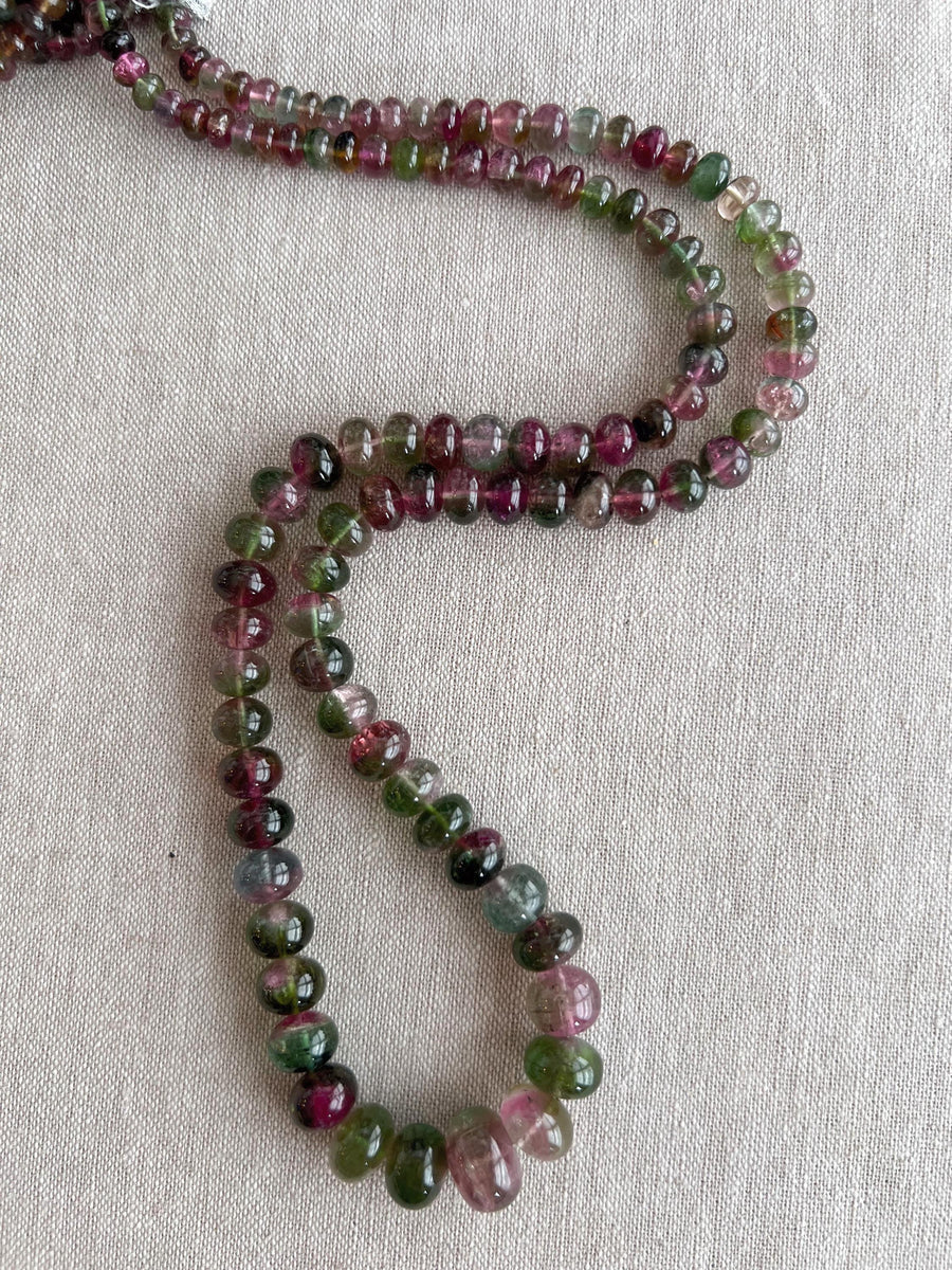 AAA-grade natural bi-color tourmaline smooth rondelle gemstone beads, graduated from 5.5mm to 11mm, featuring beautiful natural color variations for jewelry making.