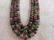 AAA-grade natural bi-color tourmaline smooth rondelle gemstone beads, graduated from 5.5mm to 11mm, featuring beautiful natural color variations for jewelry making. triple strand detail shot of beads