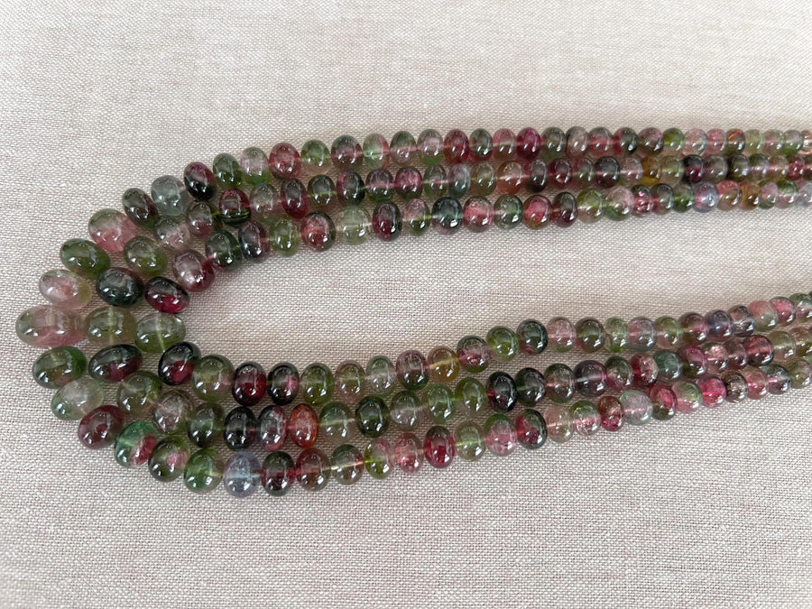 AAA-grade natural bi-color tourmaline smooth rondelle gemstone beads, graduated from 5.5mm to 11mm, featuring beautiful natural color variations for jewelry making. triple strand