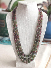 AAA-grade natural bi-color tourmaline smooth rondelle gemstone beads, graduated from 5.5mm to 11mm, featuring beautiful natural color variations for jewelry making. 3 strands on a bust