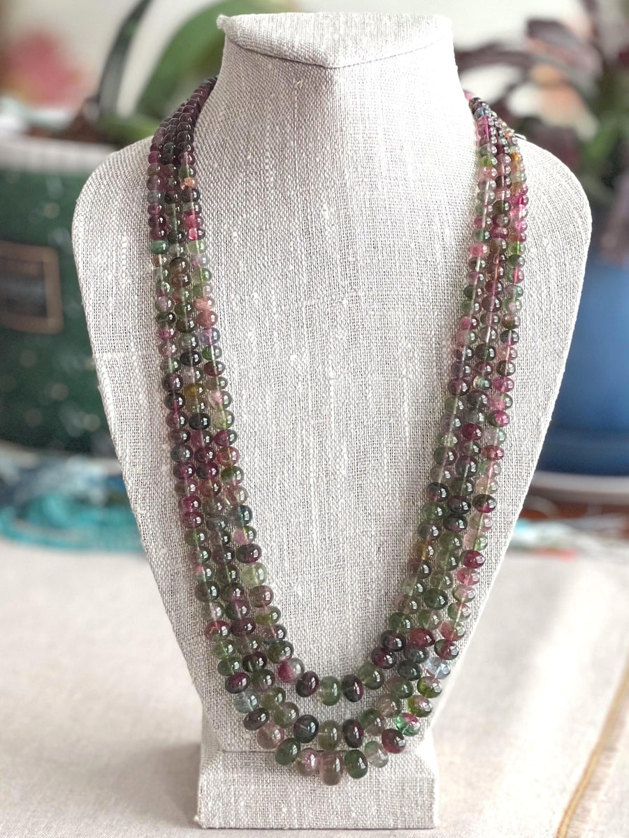 AAA-grade natural bi-color tourmaline smooth rondelle gemstone beads, graduated from 5.5mm to 11mm, featuring beautiful natural color variations for jewelry making. 3 strands on a bust