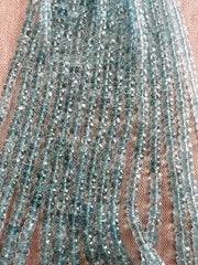 AAA unheated Aquamarine gemstone beads featuring beautiful medium blue color, excellent transparency, and finely faceted rondelle shapes.