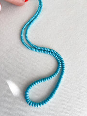 Strand of natural Arizona old-mine Sleeping Beauty Turquoise faceted rondelle beads, graduated from 3mm to 6.5mm for fine jewelry making. white background