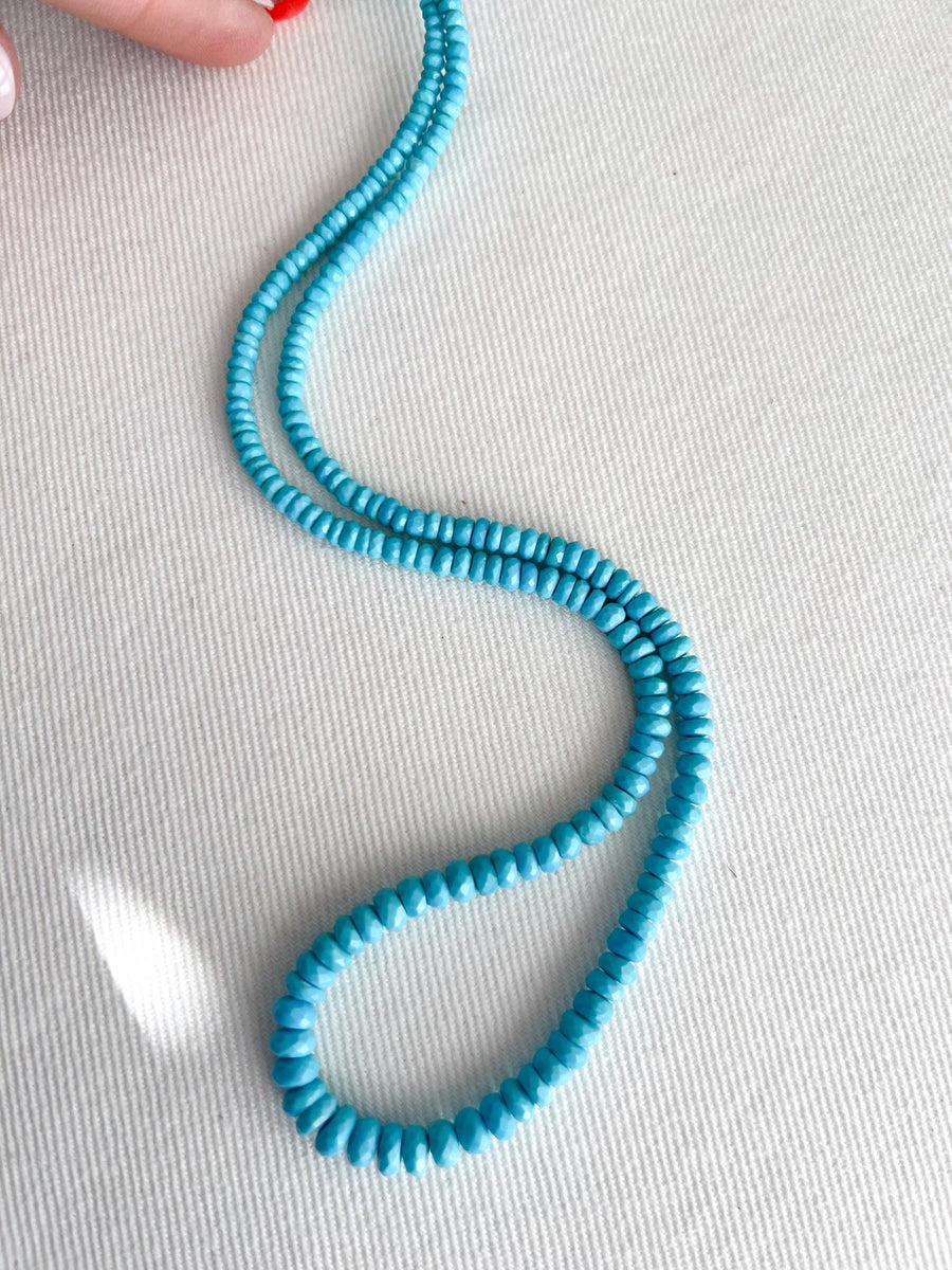 Strand of natural Arizona old-mine Sleeping Beauty Turquoise faceted rondelle beads, graduated from 3mm to 6.5mm for fine jewelry making. white background