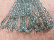 High-grade natural Aquamarine faceted rondelle beads from Brazil, approximately 140 gemstones with consistent blue color and brilliant sparkle.