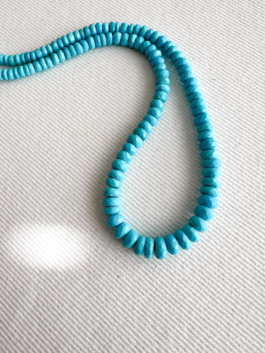 AAA Sleeping Beauty Turquoise gemstone beads featuring precision faceted rondelle shapes and classic Arizona turquoise blue coloration.