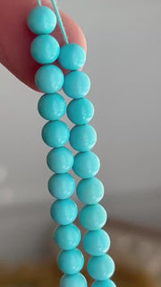 AAA+ Sleeping Beauty Turquoise smooth round beads, natural Arizona turquoise, 6mm, 16-inch gemstone strand. close up video