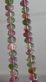 AAA-grade natural bi-color tourmaline smooth rondelle gemstone beads, graduated from 5.5mm to 11mm, featuring beautiful natural color variations for jewelry making. video