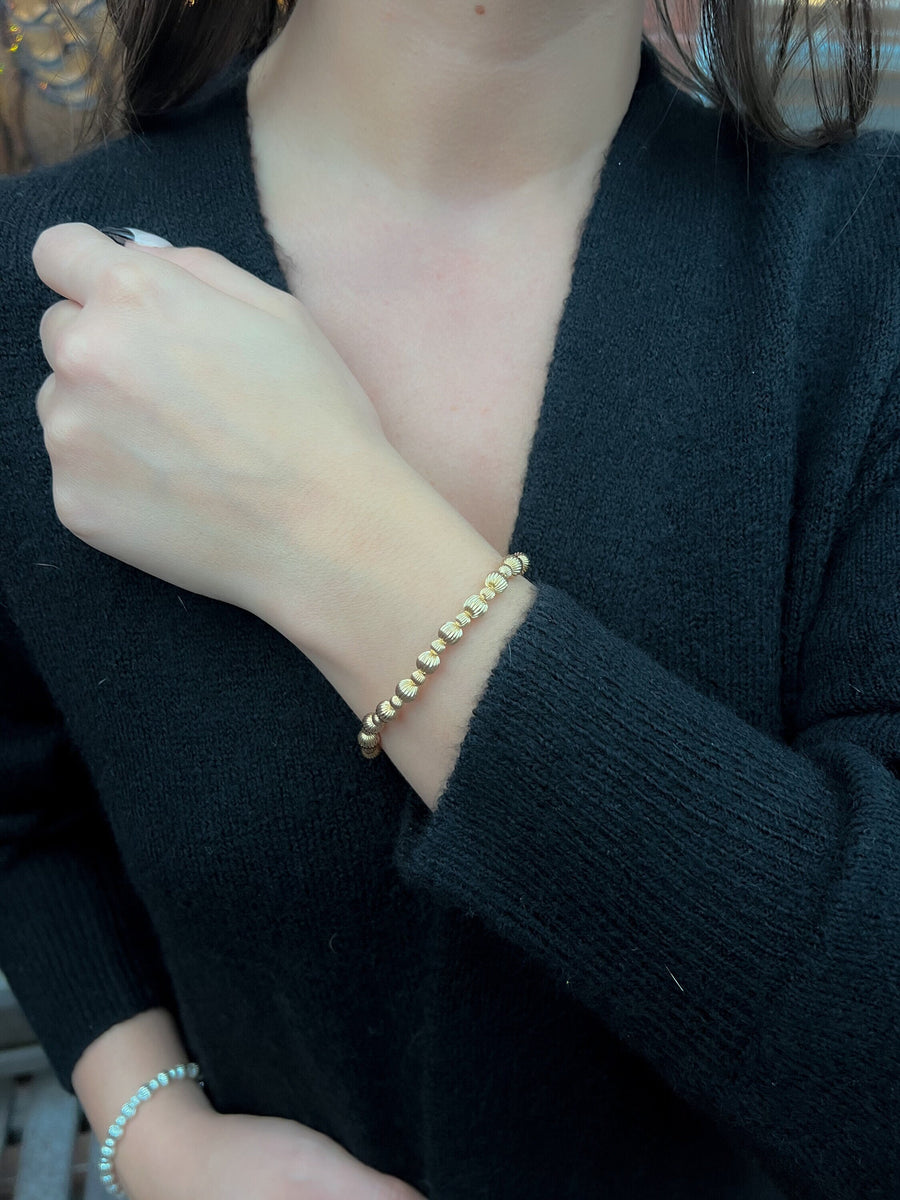 Gold_Bead_Bracelet,Textured_Gold_Beads,Corrugated_beads,Gold_bracelet,Stretch_bracelet,Stacking_bracelet,Layering_bracelet,Festive_Jewelry,Holiday_jewelry,Gift_She_Will_Love,Handmade_bracelet,Trendy_bracelet,Classic_Style